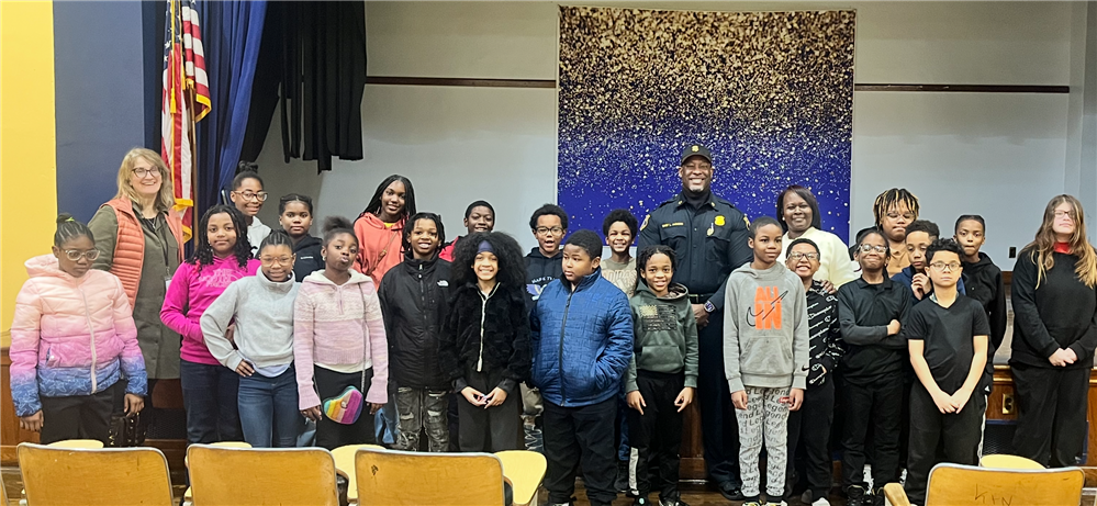  Students and Teacher standing next to Chief Jackson